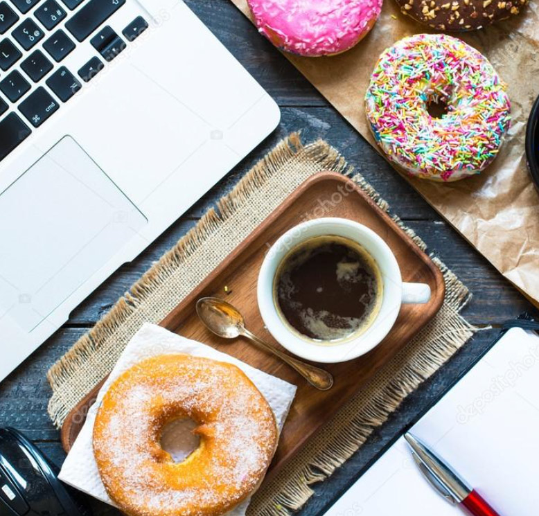 A laptop and donuts